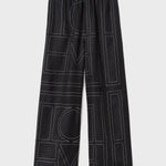 Monogram Silk Pajama Bottoms Black by Toteme - The Line