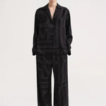 Monogram Silk Pajama Bottoms Black by Toteme - The Line